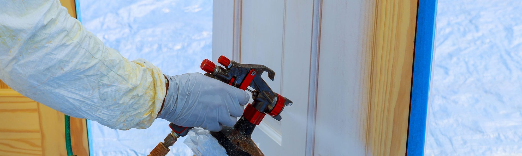 House Repair Paint The Wooden Door In White Color With A Spray