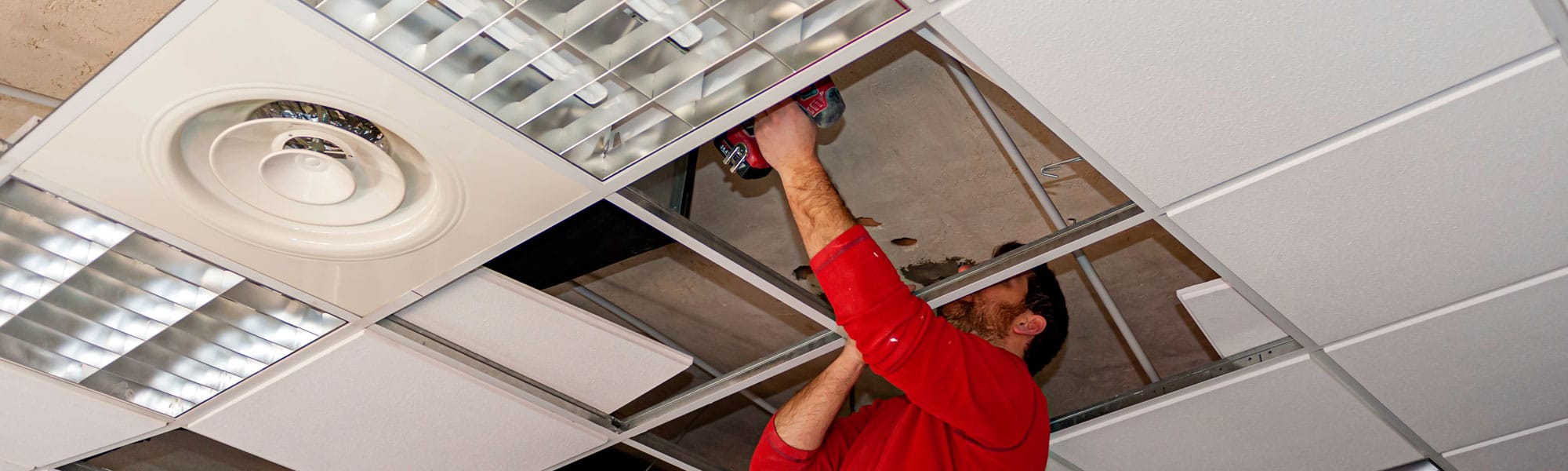 Suspended Ceiling With Drywall And Fixing The Drywall To The Ceiling Metal Frame.